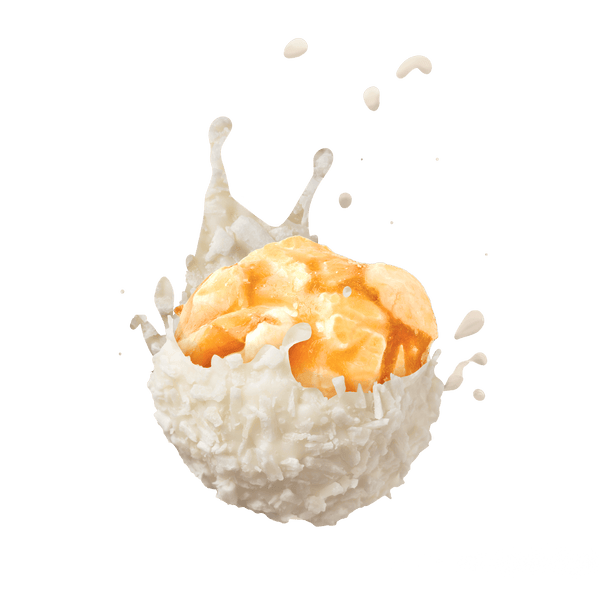 Krusty Krunch Crushed Coconut Popcorn coated in white chocolate, splashing in creamy milk.