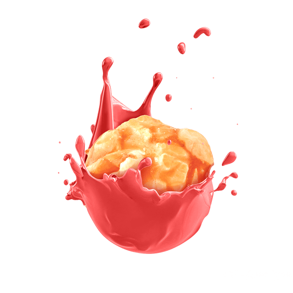 Krusty Krunch Crushed Coconut Popcorn splashing in vibrant red sauce, highlighting its unique flavor and artisanal quality.