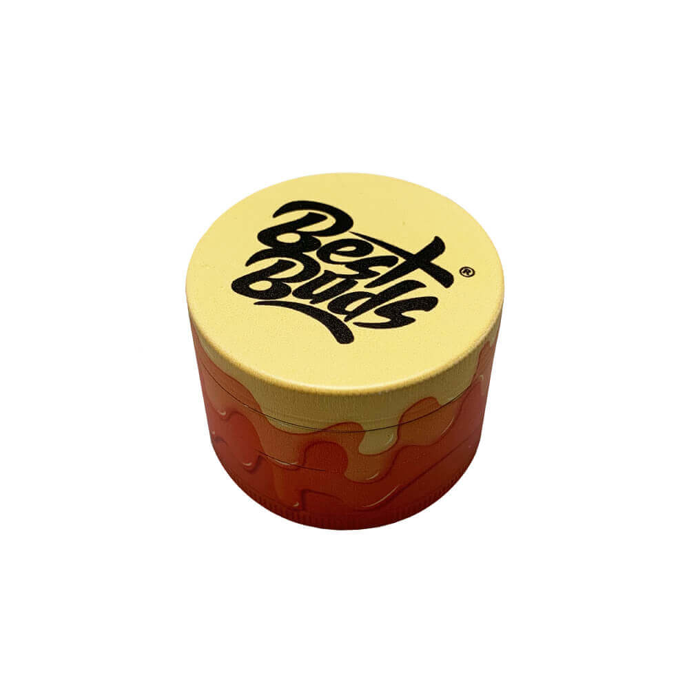 Best Buds metal grinder with yellow lid, designed for efficient herb grinding and stylish display.