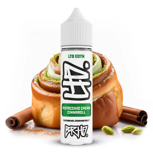 BRHD LTD EDTN Pistachio Cream Cinnaroll aroma bottle next to a delicious cinnamon roll with pistachio icing.