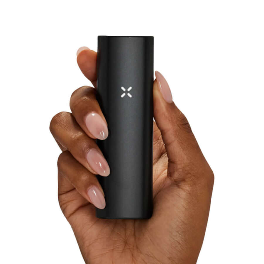 PAX Plus Onyx Dry Herb Vaporizer held in hand, showcasing sleek design and modern features for herb enthusiasts.